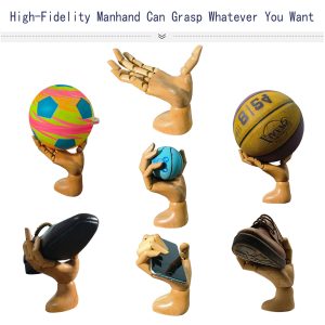 High-fidelity male articulated wooden hand grasping various objects (balls, shoes, phone), demonstrating versatile holding capability