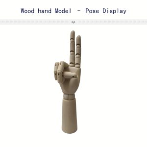 Painted female wooden articulated mannequin hand in peace gesture pose